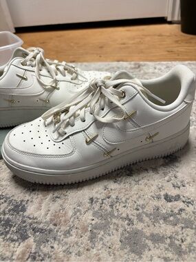 White Nike Air Force 1 with Gold Nike Charms